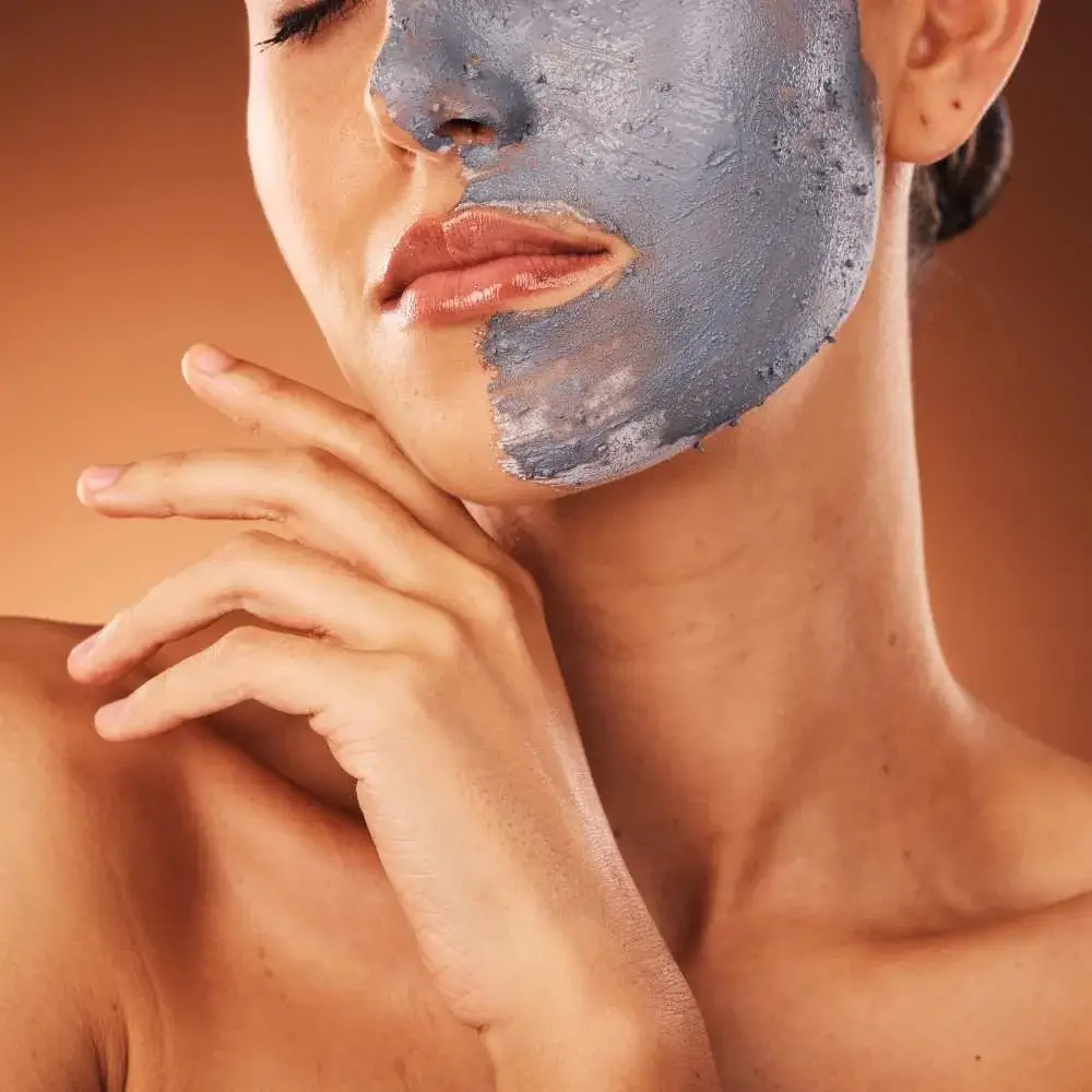 Applying acne-fighting Korean face mask