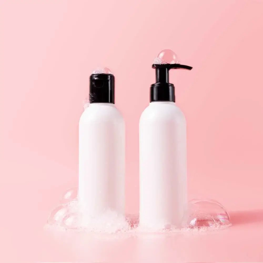 Shampoo and conditioner bottles with key ingredients for thick hair