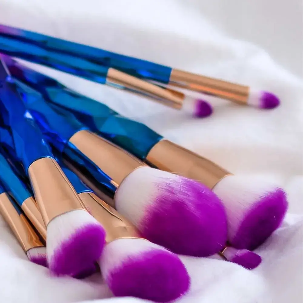 neatly arranged makeup brushes drying on a towel