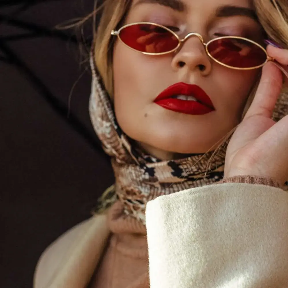 Model showcasing a bold, long-lasting matte lipstick look