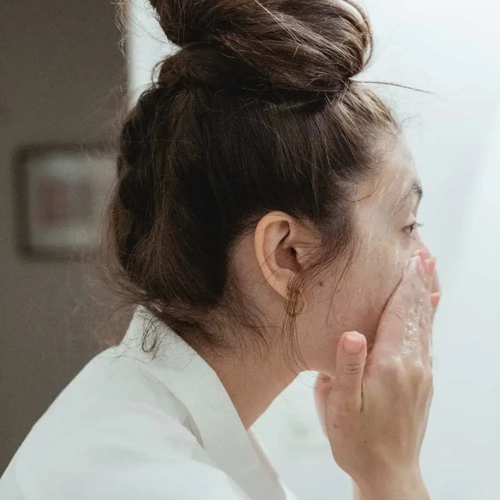 showing the proper way to apply face wash for blackhead removal