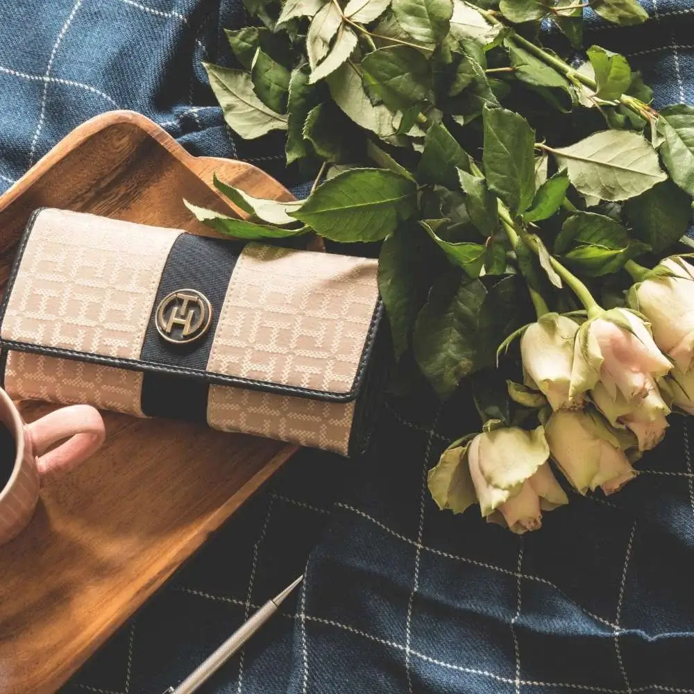 Classic bride wallet nestled in a bridal bouquet