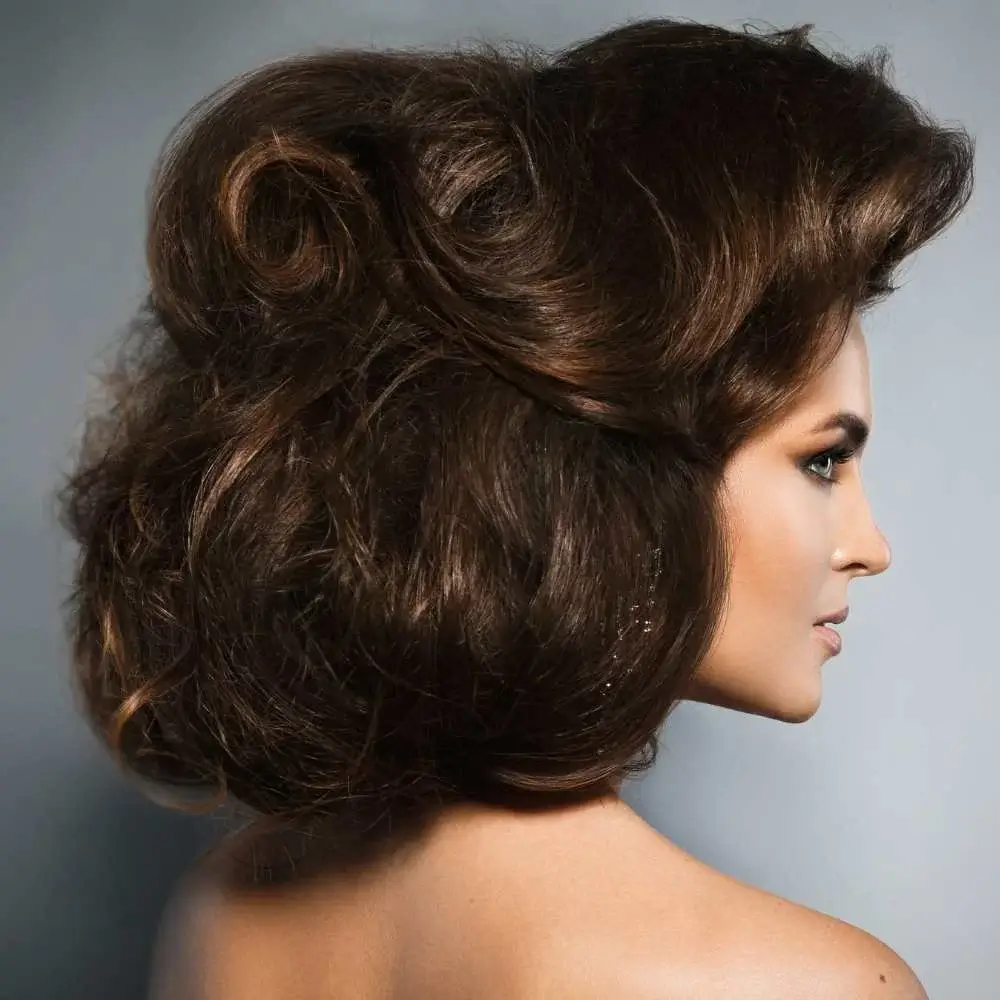 A woman showcasing her thick hair after using the right shampoo and conditioner