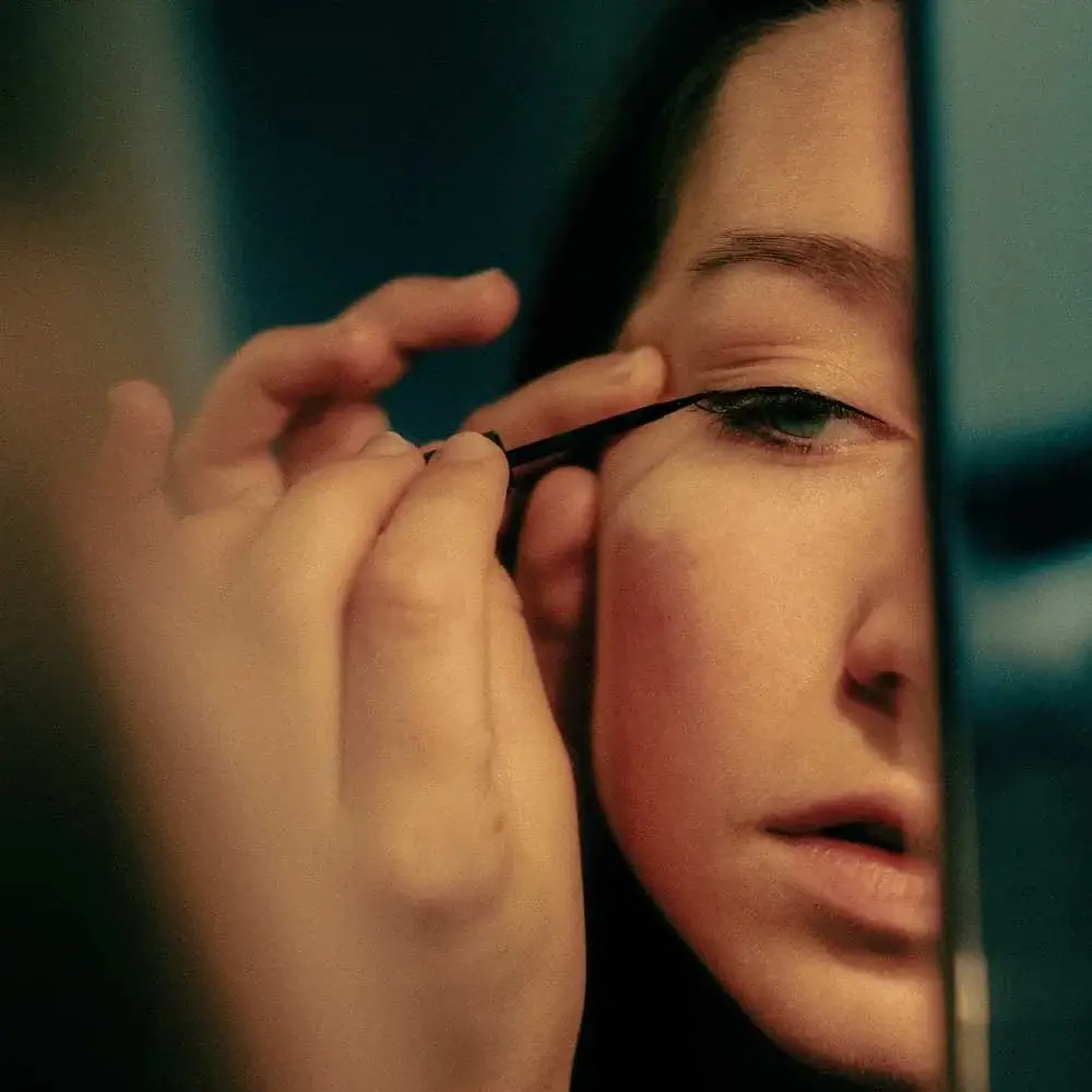 Water-activated eyeliner being applied on a model's eye