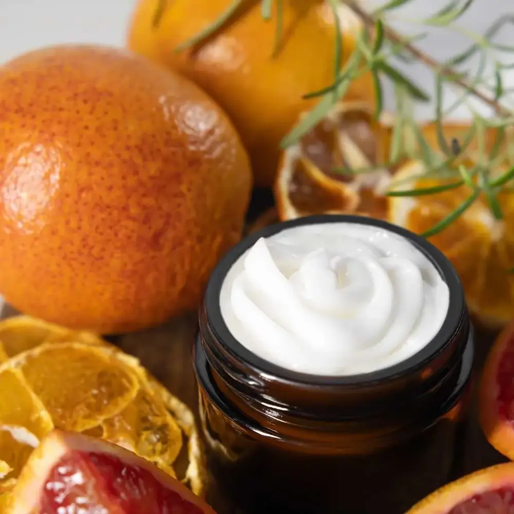 Close-up image of a jar of Vitamin C cream for radiant skin