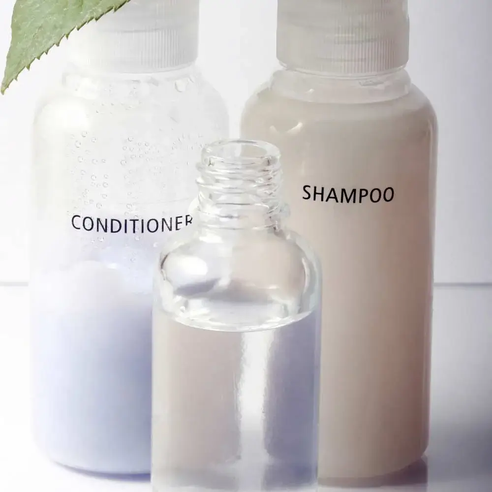 Bottles of the highest-rated drugstore shampoo and conditioner displayed together