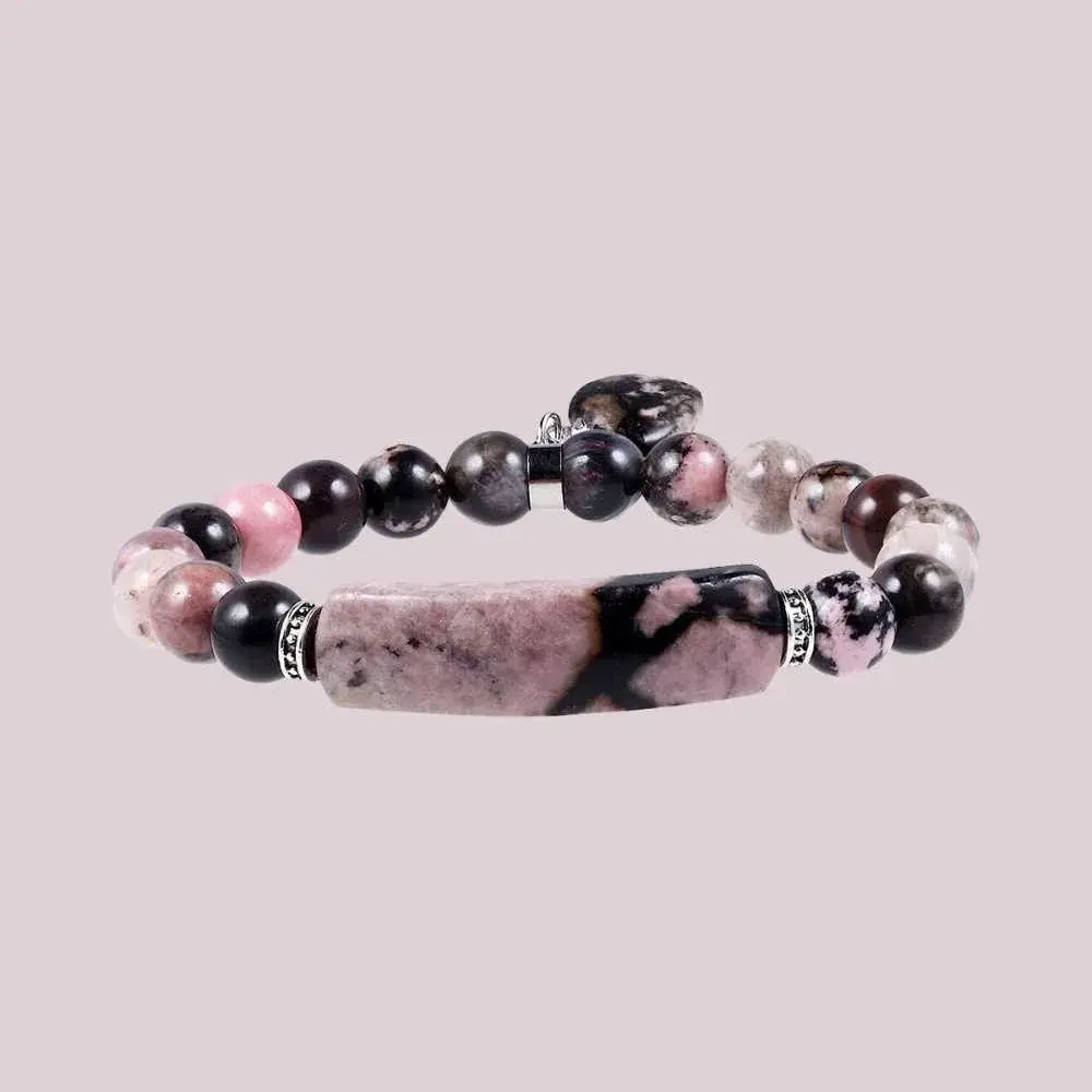 rhodonite bracelet on a light pink background