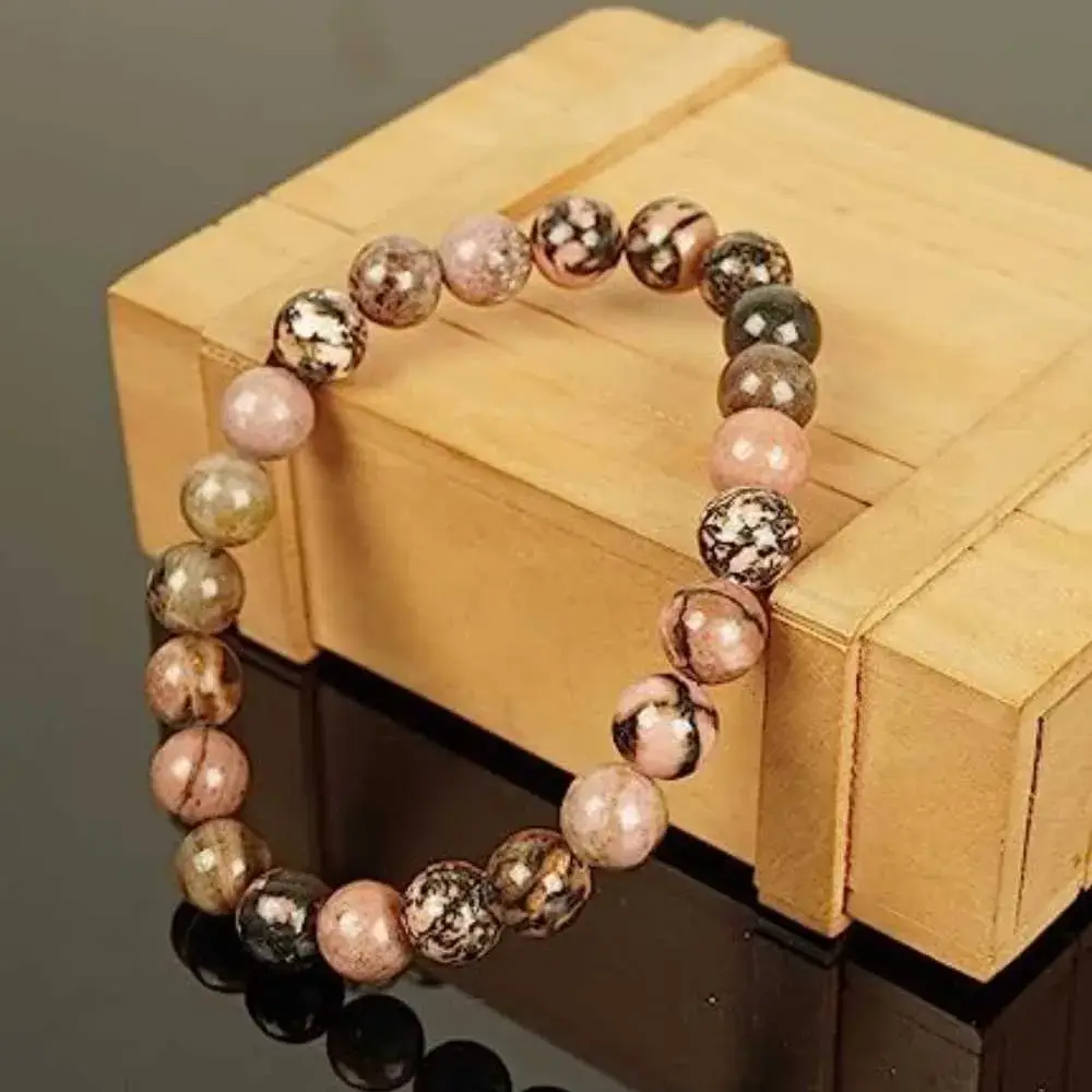 rhodonite bracelet and a wood