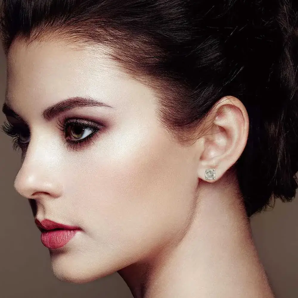 close-up portrait of a beautiful woman wearing salt and pepper diamond earring
