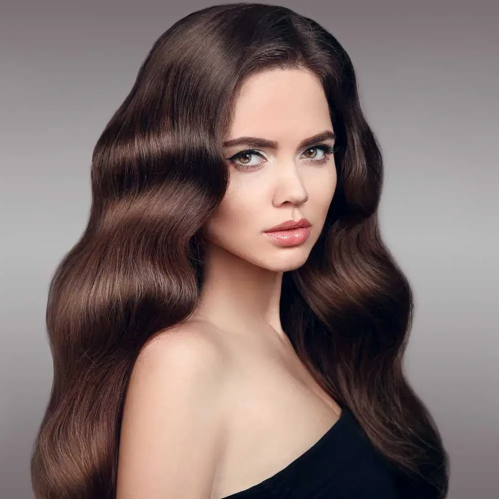 portrait of a woman with thick wavy brown hair