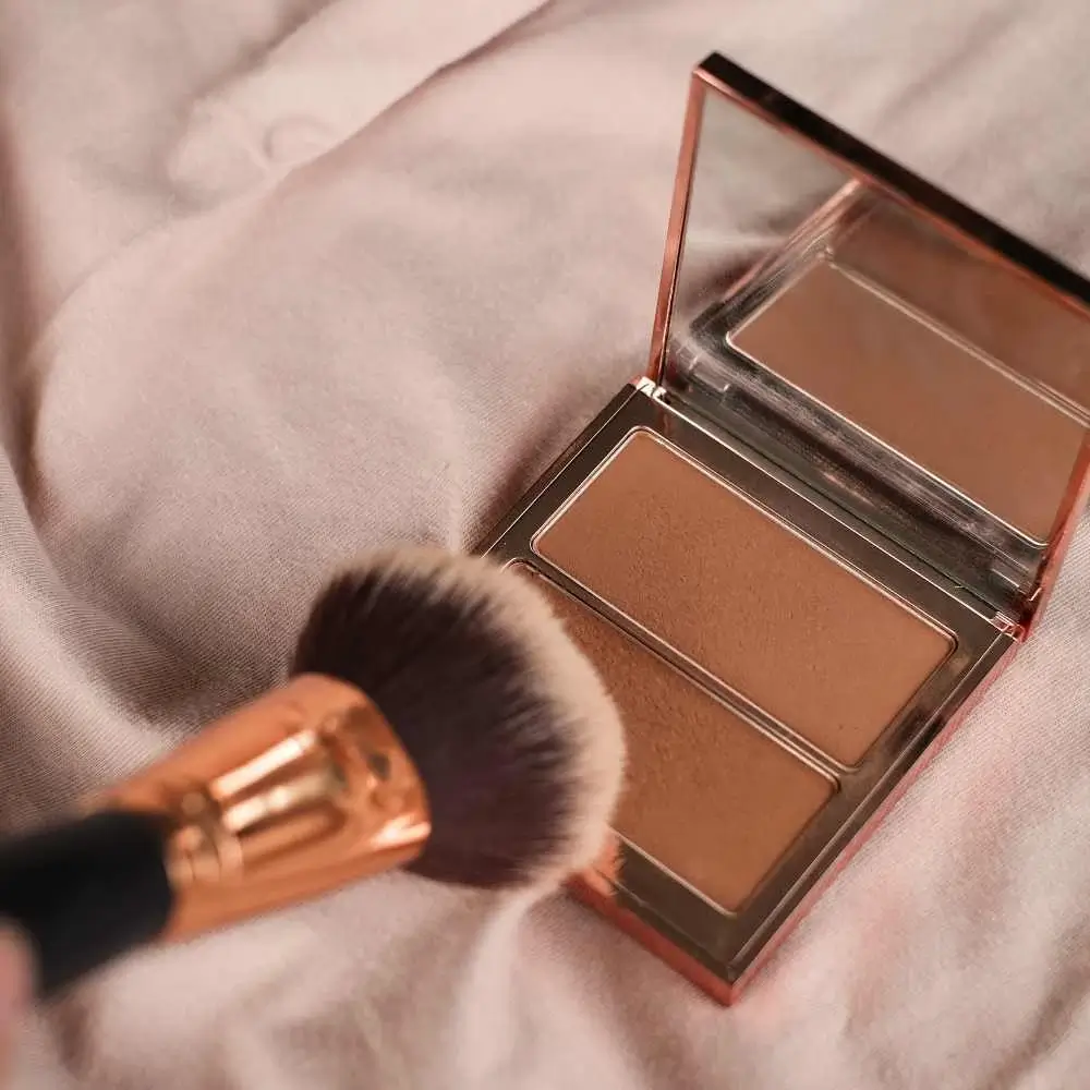 bronzer and a makeup brush