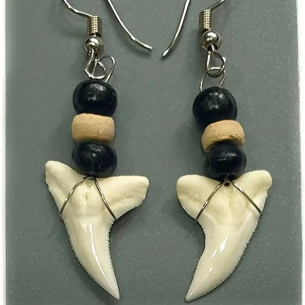 pair of shark tooth earrings with black beads