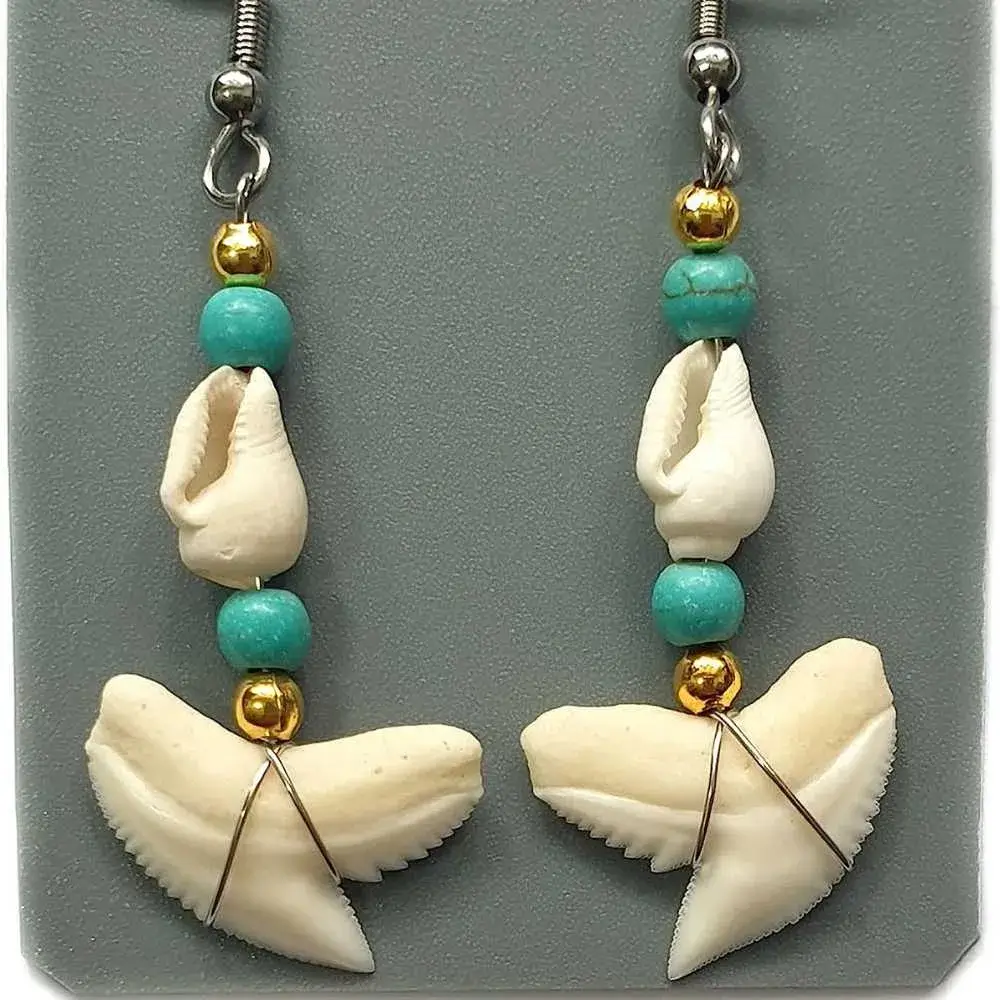 pair of shark tooth earrings with gold and turquoise beads