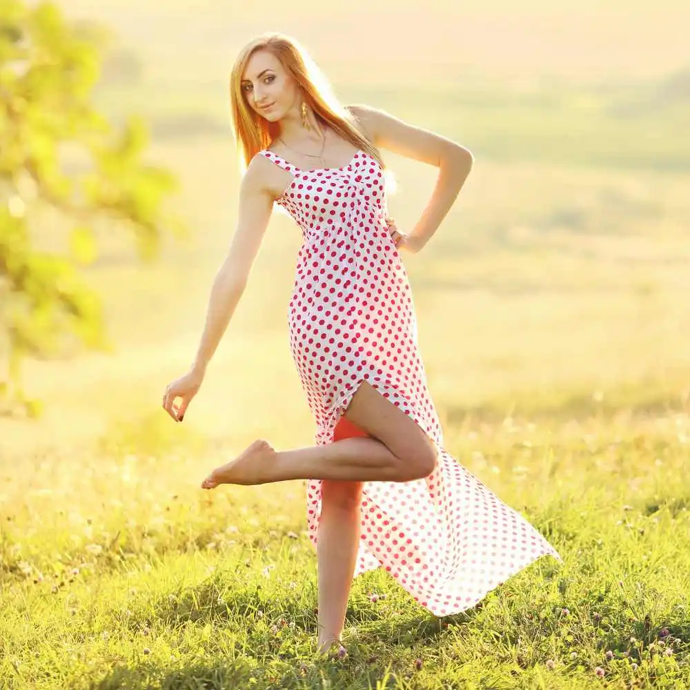 blonde woman in a red polka dot dress