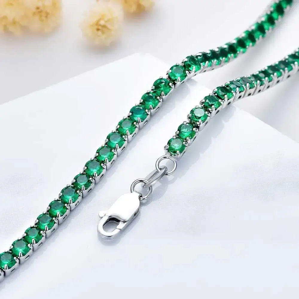 close-up view of an  emerald tennis necklace