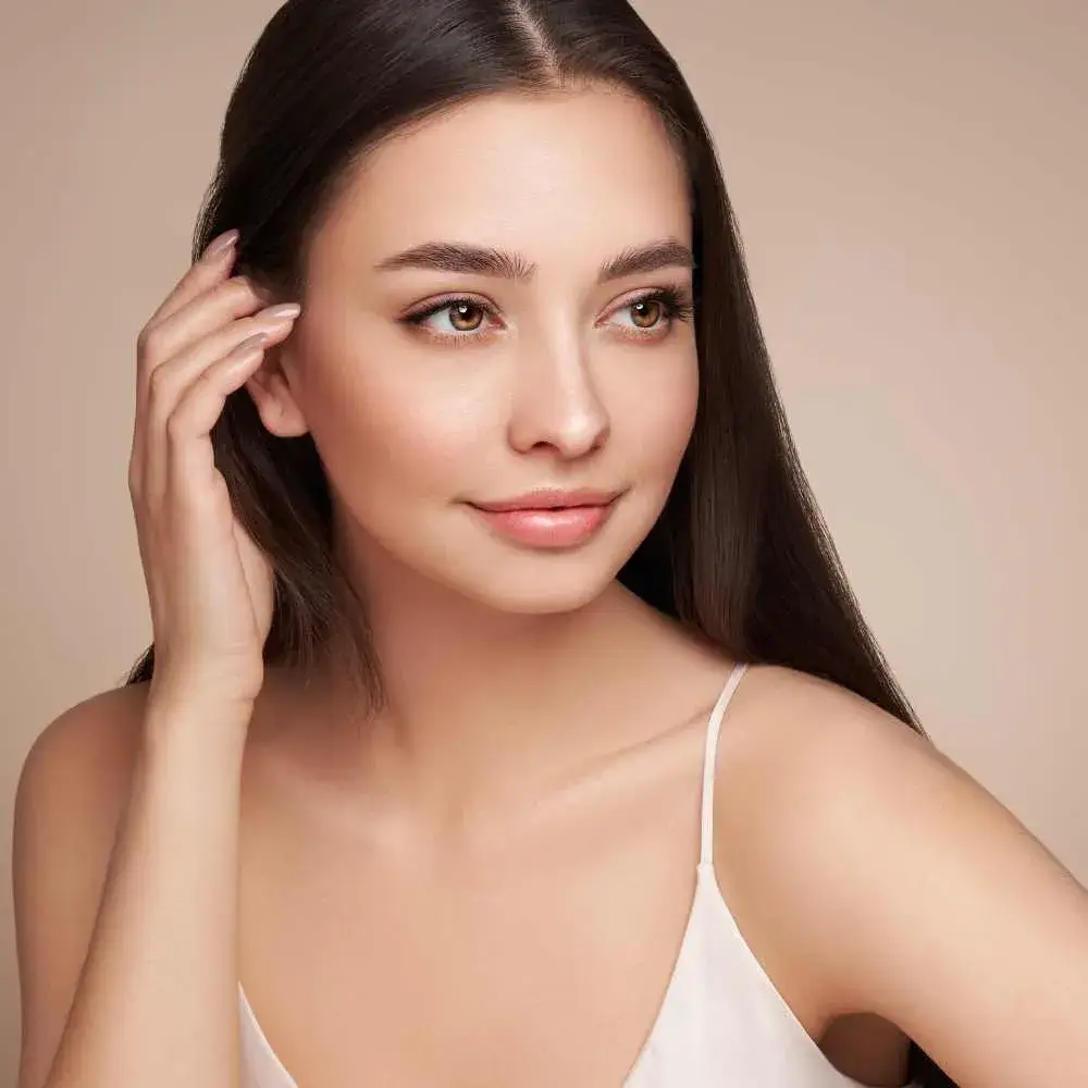 closeup portrait of a beautiful woman with healthy and moisturized skin