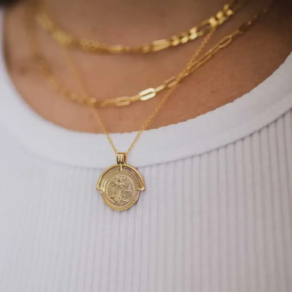 close-up of aphrodite necklace on a woman