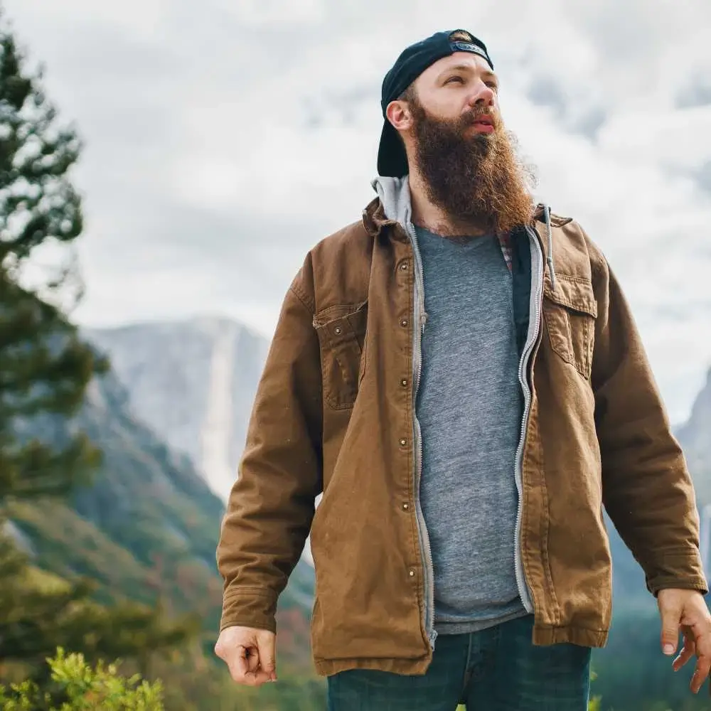 young man with beard outdoors