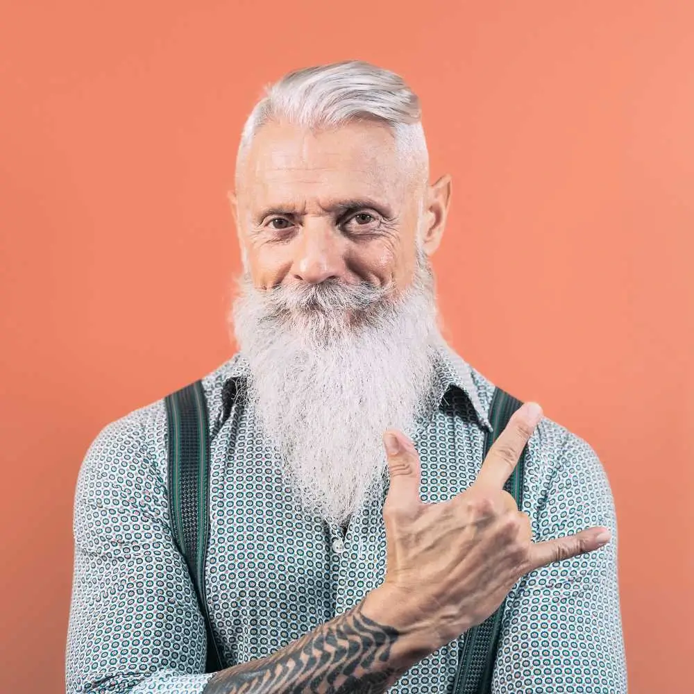 mature male with beard posing in front of the camera