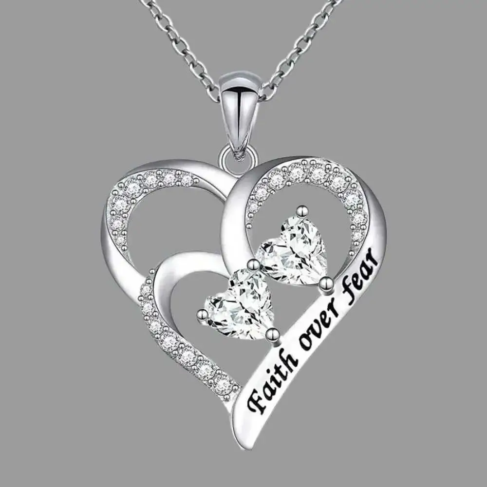 silver faith over fear necklace in heart with crystals