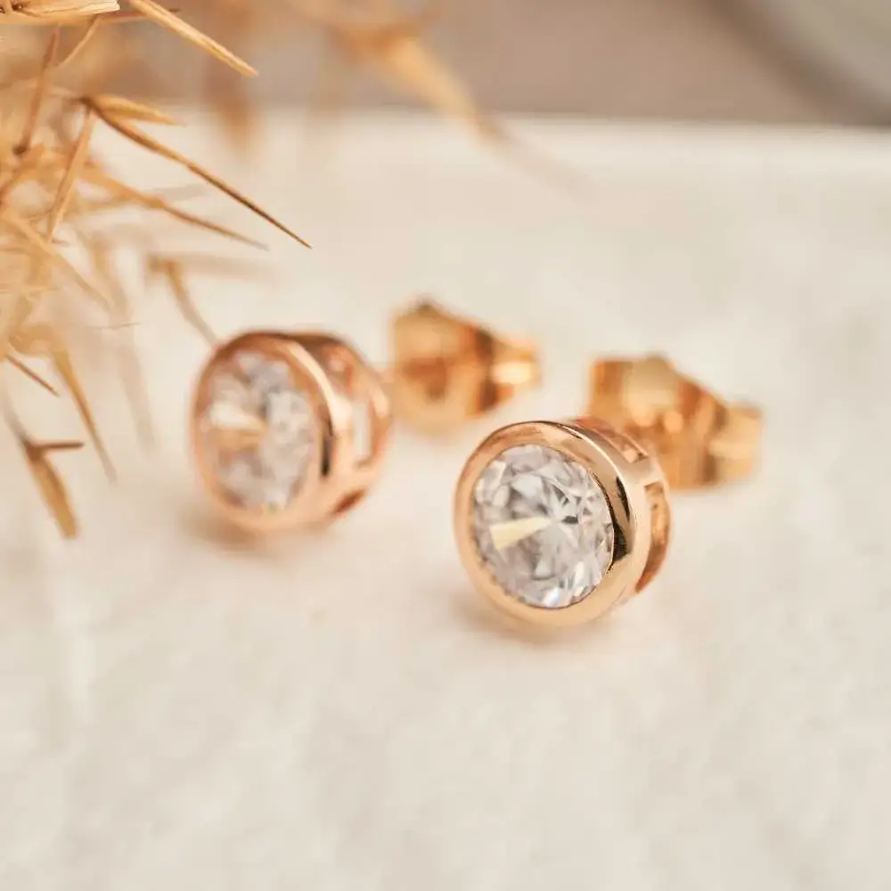 golden stud earrings with crystal