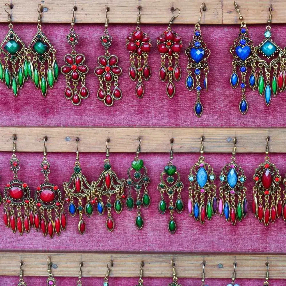 collection of different colors and designs of Indian-style drop earrings