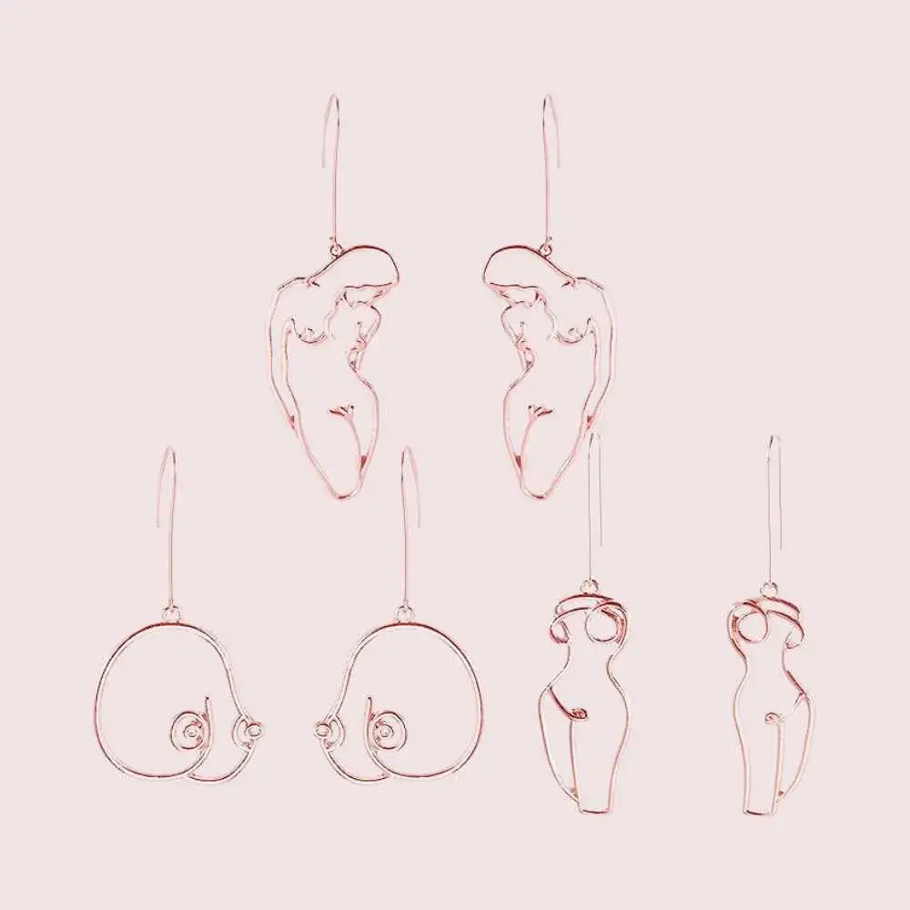 three pairs of geometric female body earrings