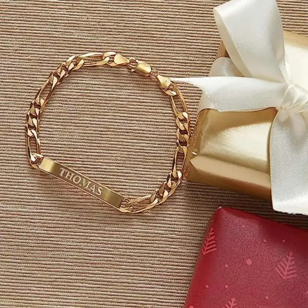 gold esclava bracelet and two jewelry boxes