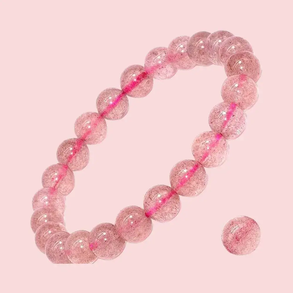 strawberry quartz bracelet on a light pink background