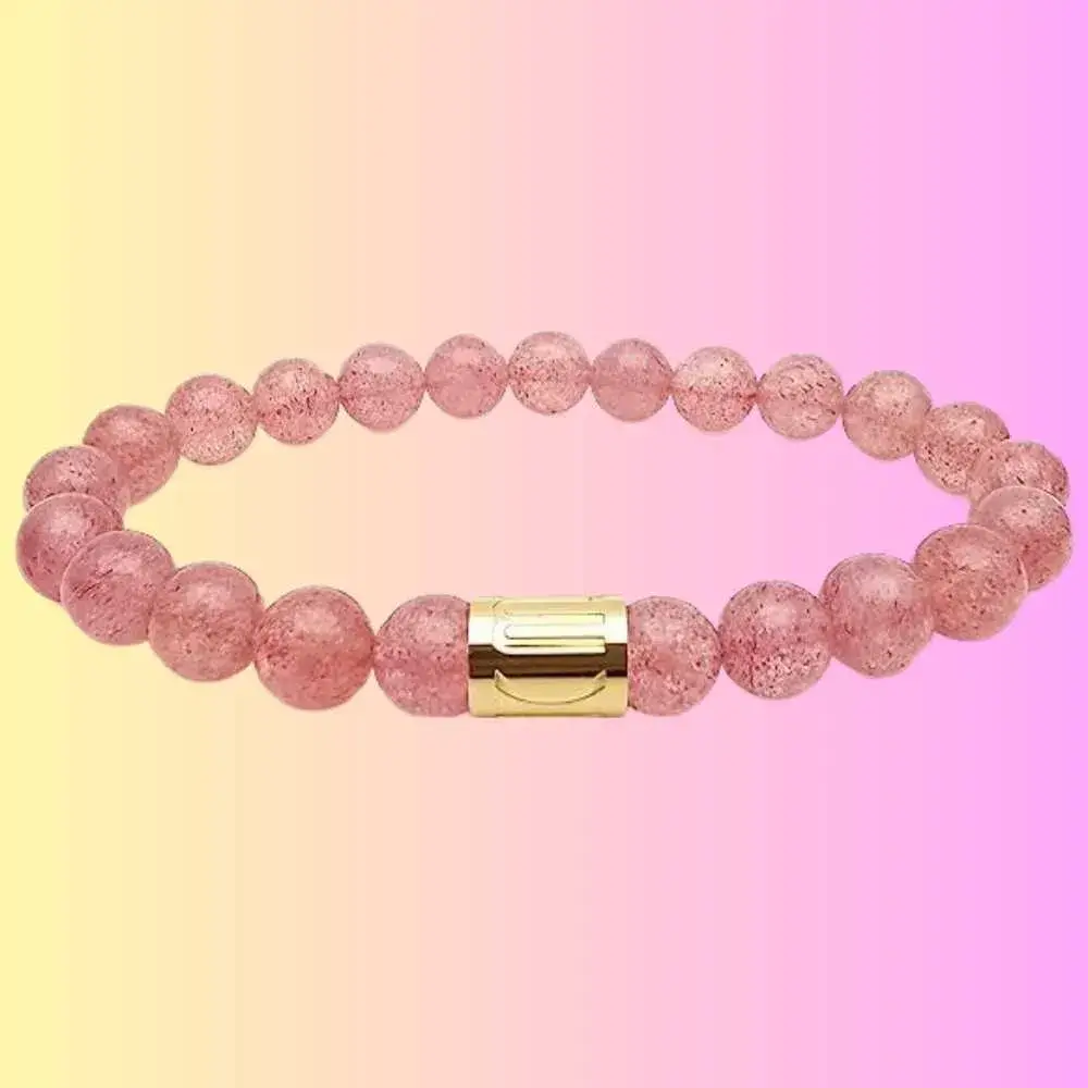 close-up of strawberry quartz bracelet with gold-plated stainless steel