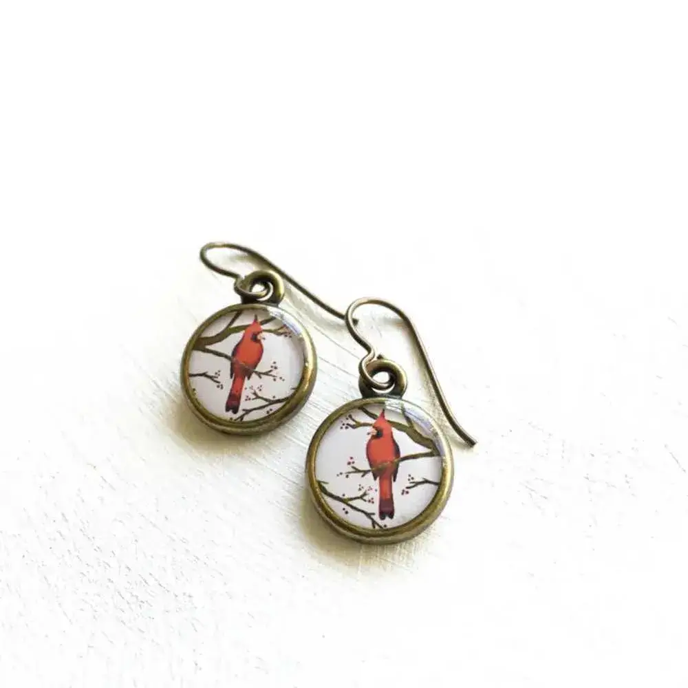 cardinal earrings on a white background