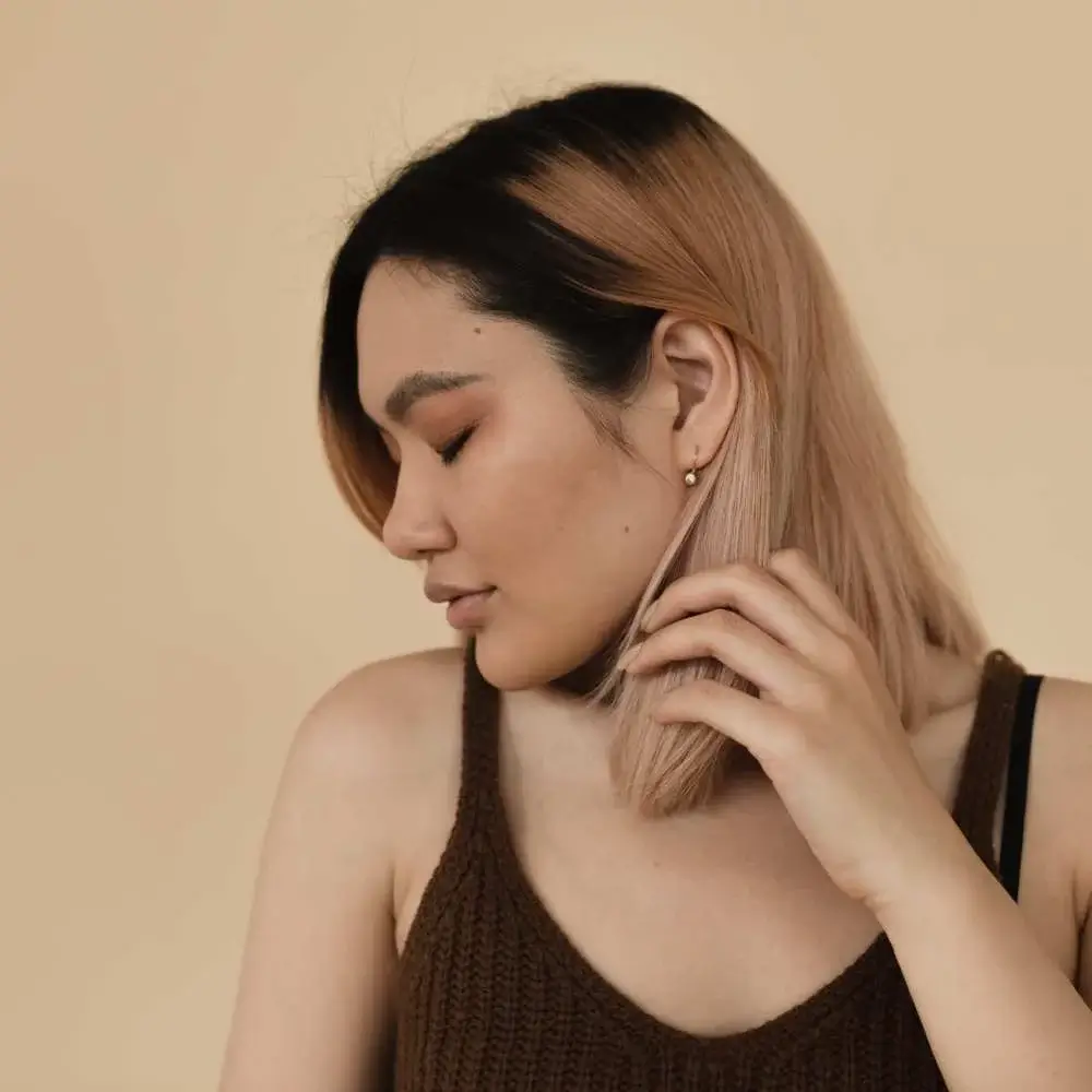 Woman with glossy hair achieved through the Korean washing method