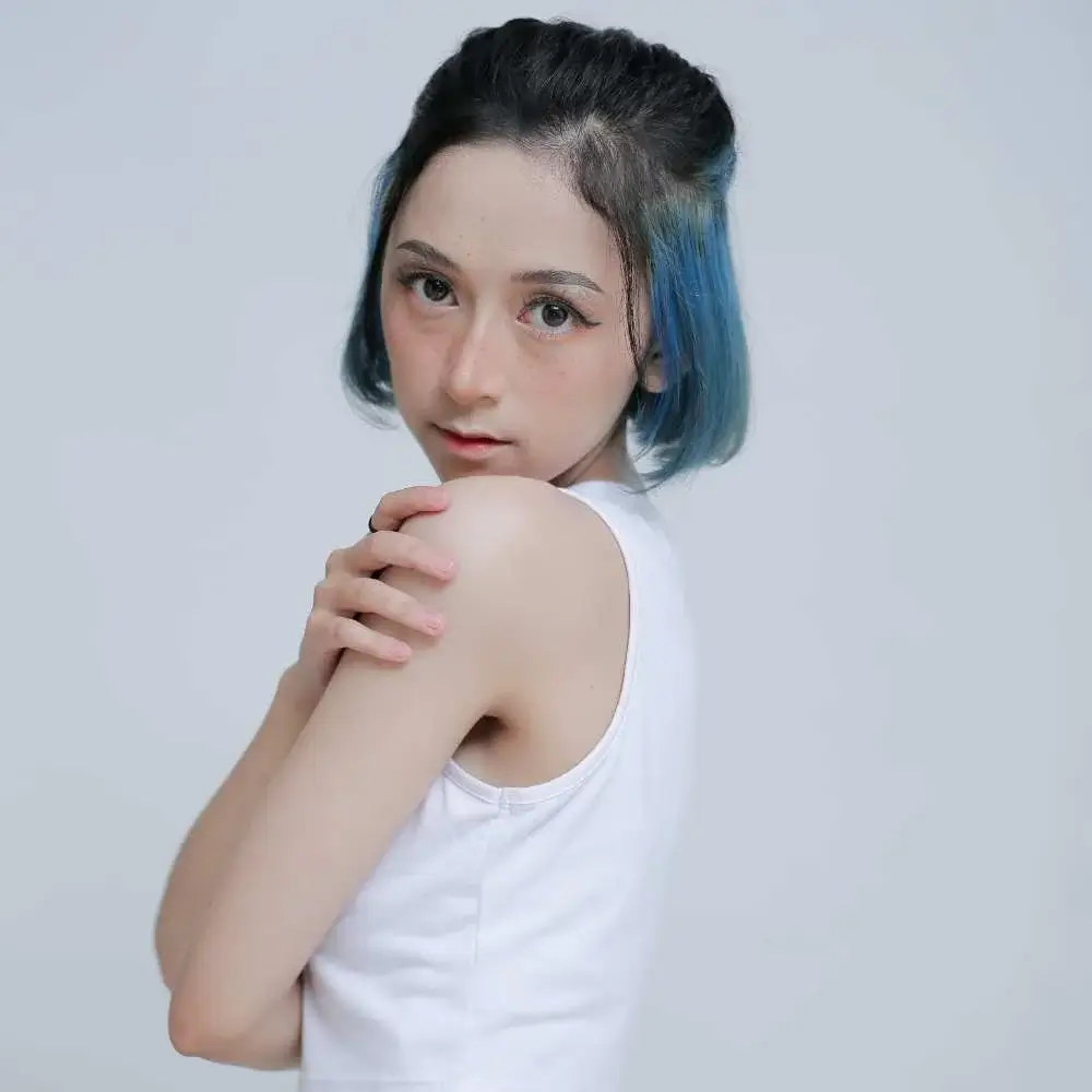 Woman expressing her personality through her perfect blue hair color
