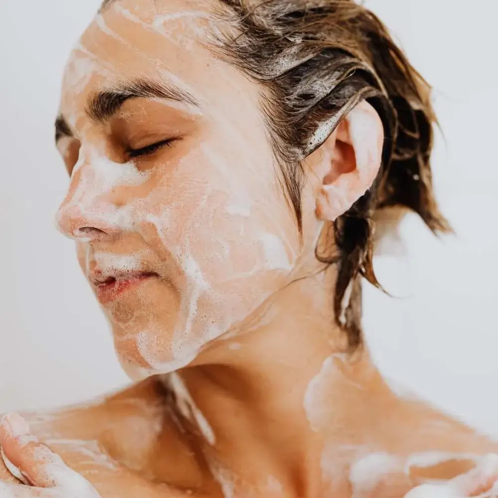 Woman appreciating the calming scent of her lavender body wash