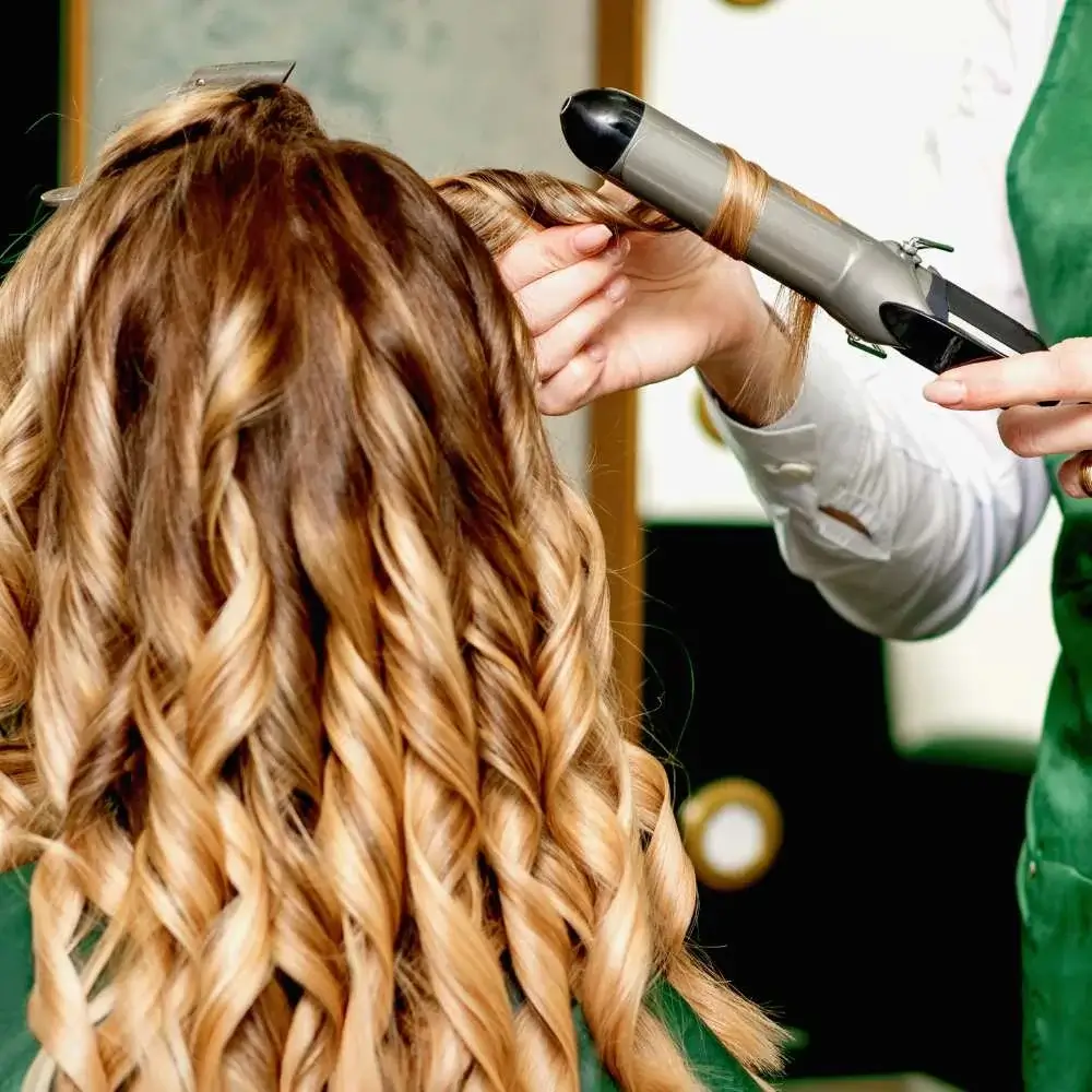 Curl fine hair before and after styling, showcasing the power of a curling iron