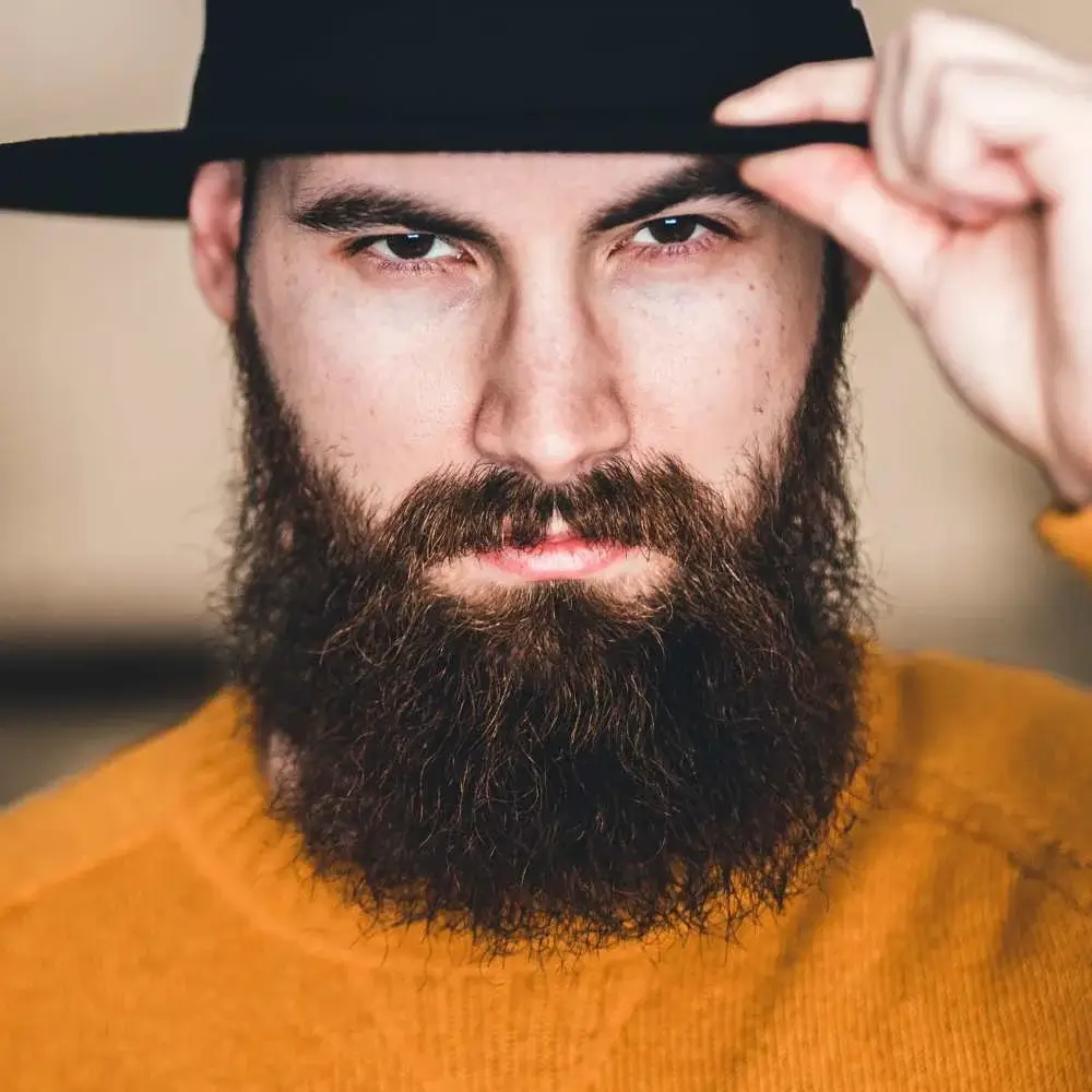 Man using beard conditioner