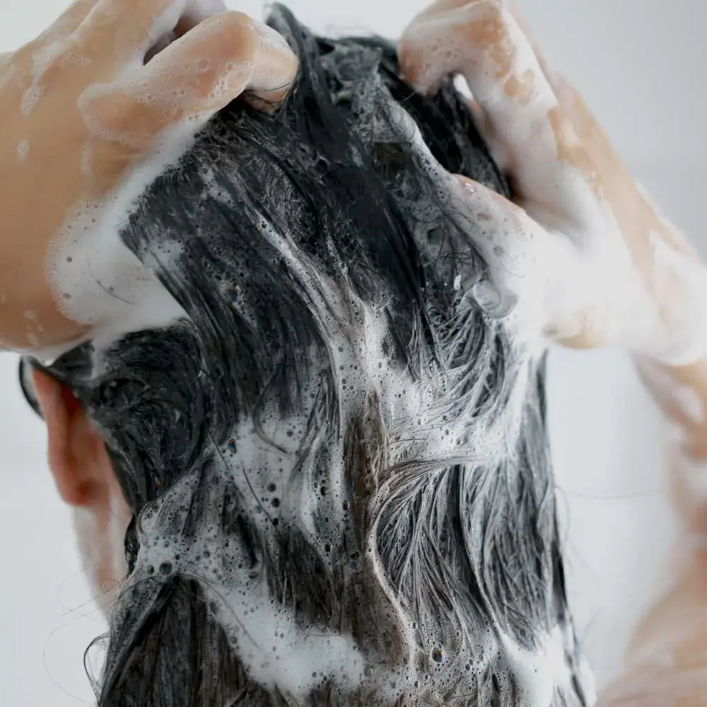 demonstrating how to wash hair using Korean techniques