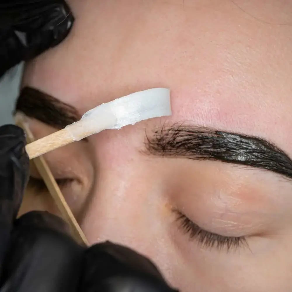 Right eyebrow perfectly shaped and groomed using specialized wax