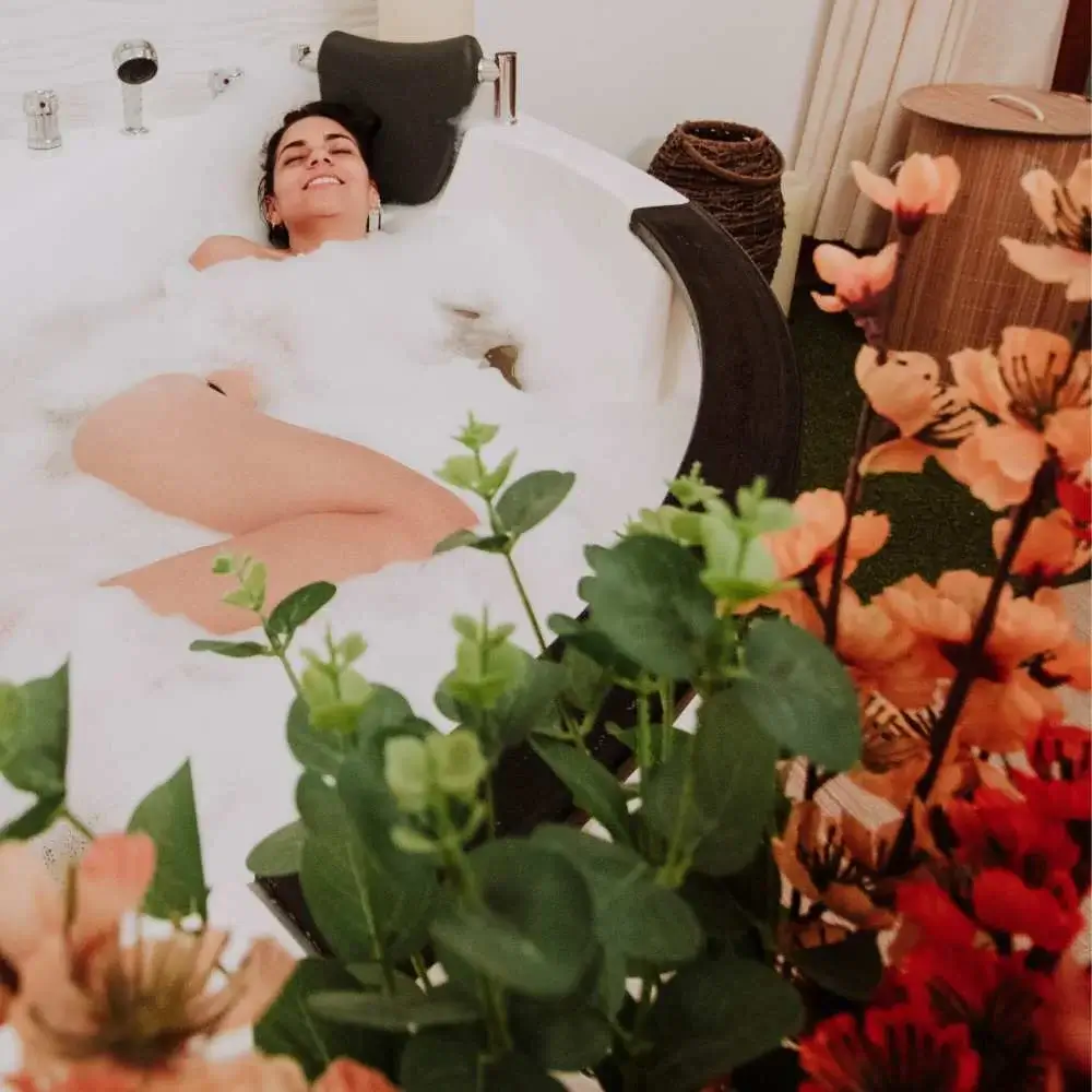 Woman enjoying her bath time with a fragrant lavender body wash