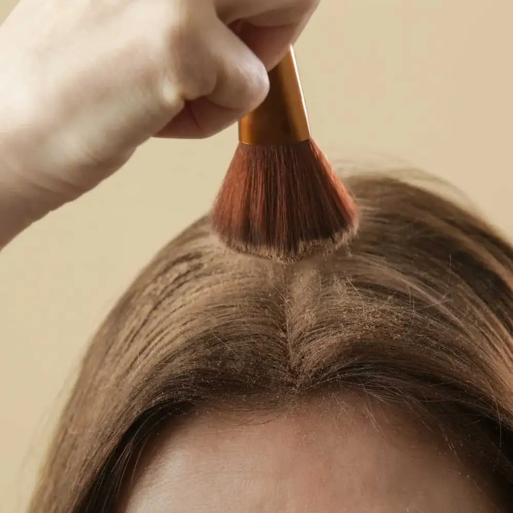 demonstrating the oil-absorbing properties of a top-rated dry shampoo