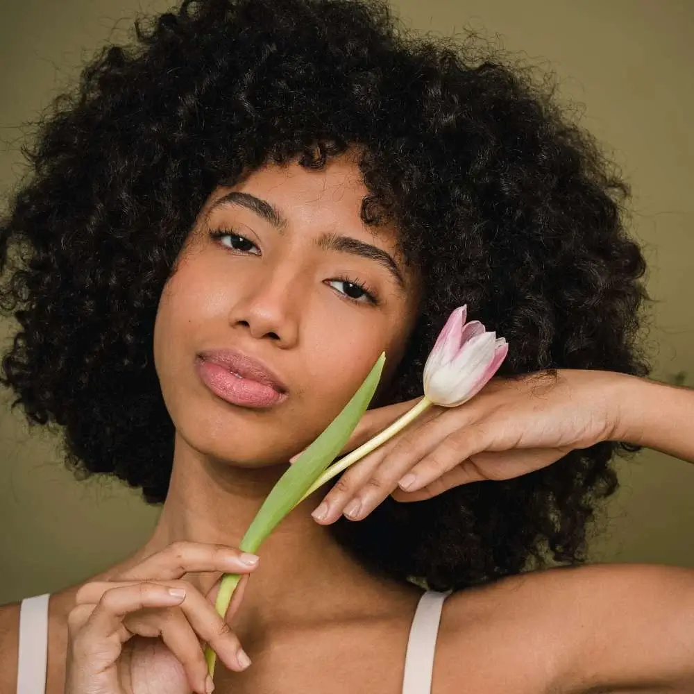 applying edge control to tame her hairline