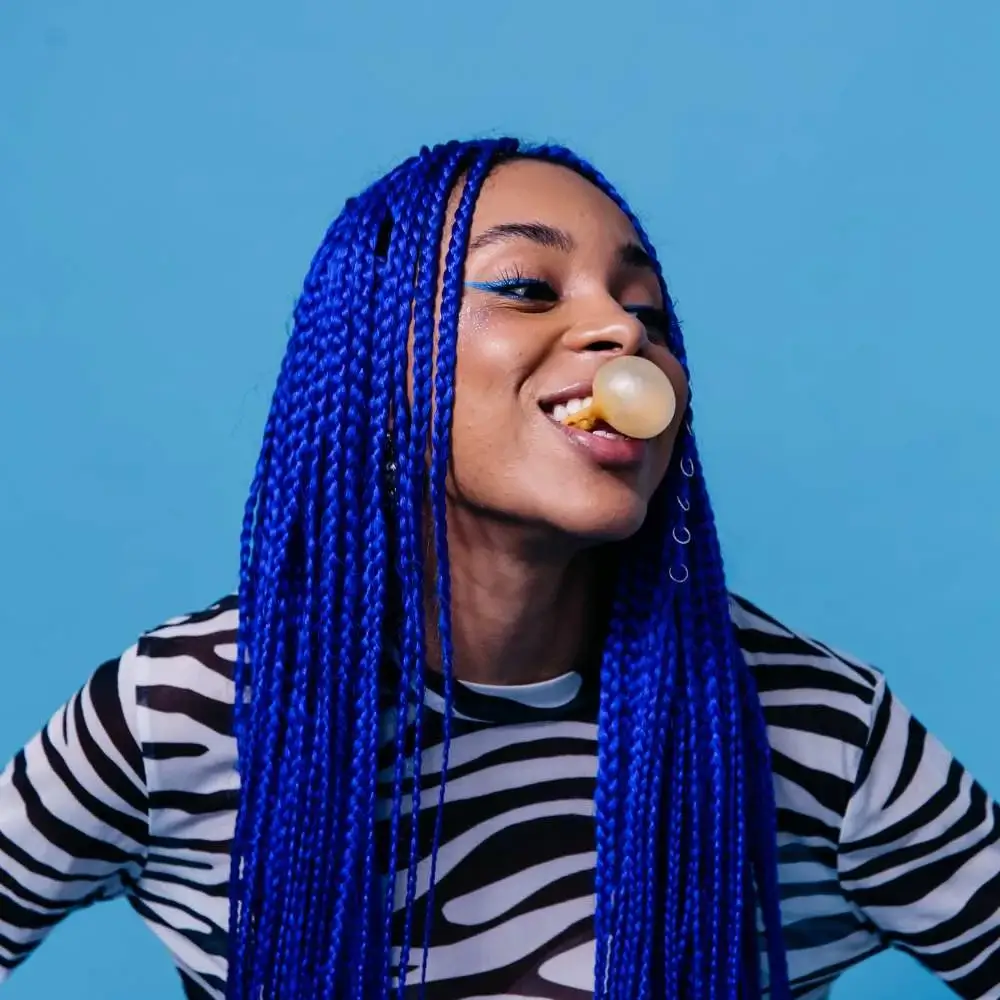 Close-up of a vibrant blue hair color on a model