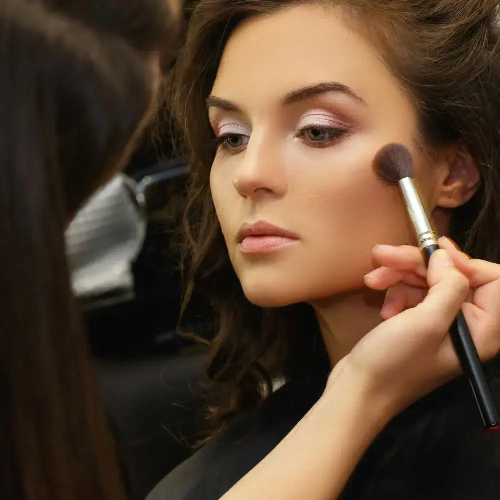 Applying bronzer with brush