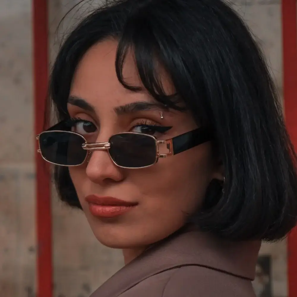 Why do angular sunglasses work well for oval faces?