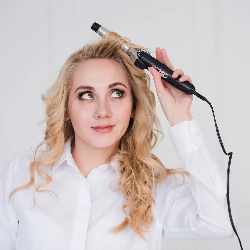 Can a hot curling brush be used on all hair types?