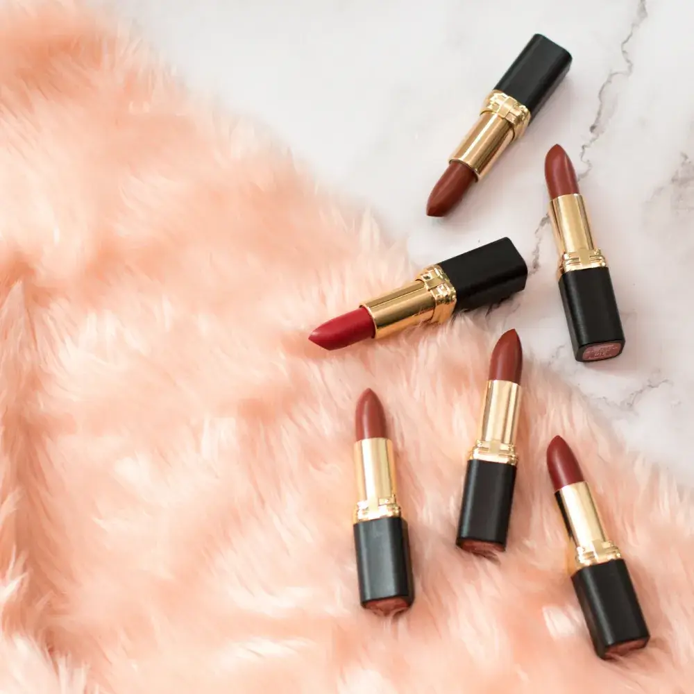 lipsticks on fur carpet flatlay