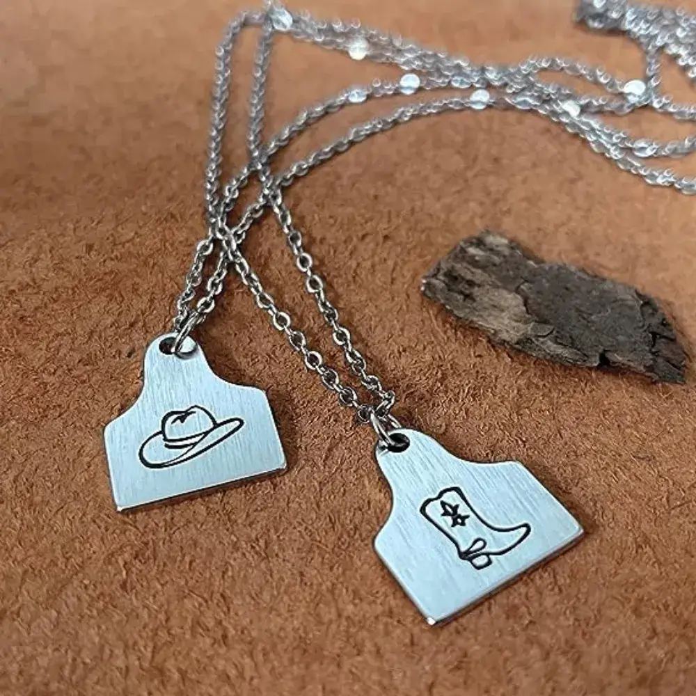 silver cow tag necklaces with cow boy hat and cow girl's boots