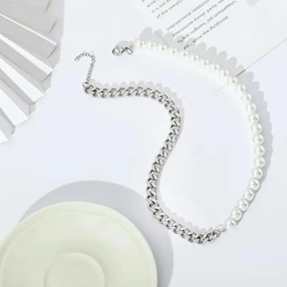 Half pearl half chain necklace on a white background