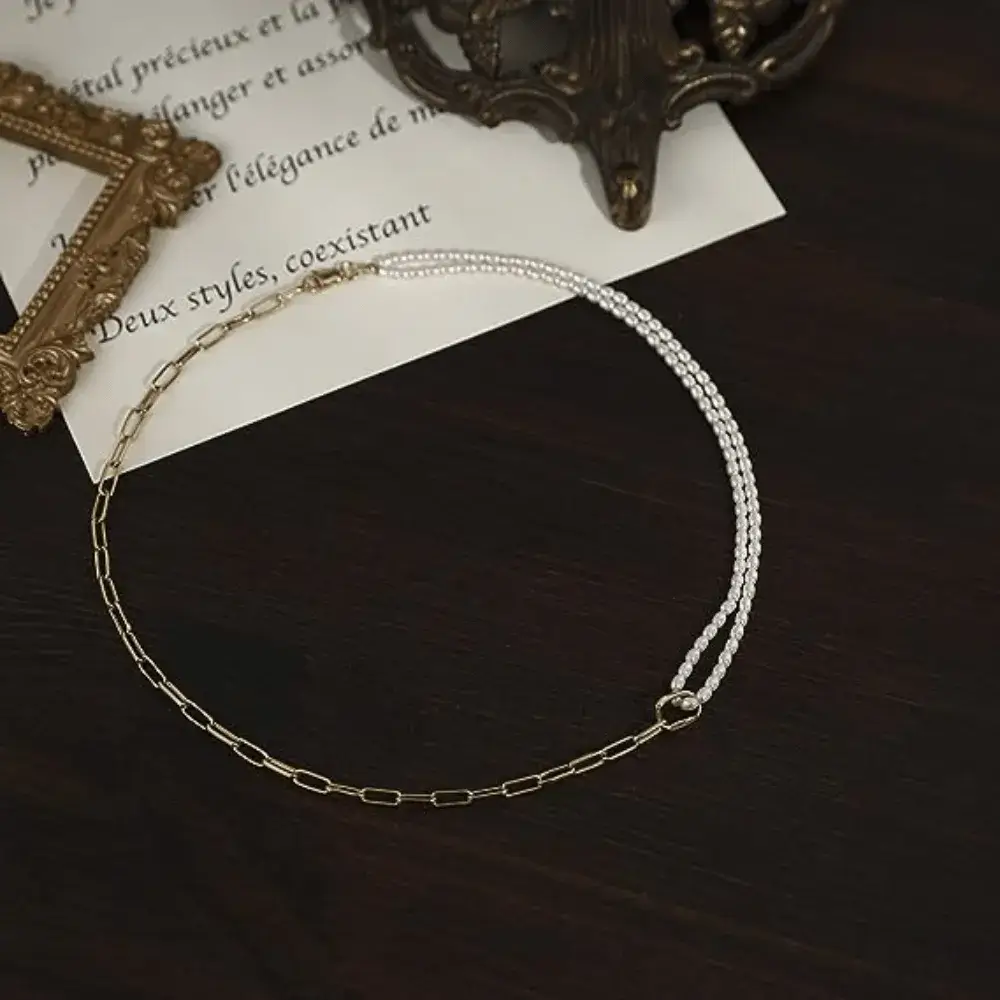 half pearl half chain necklace on a wooden table
