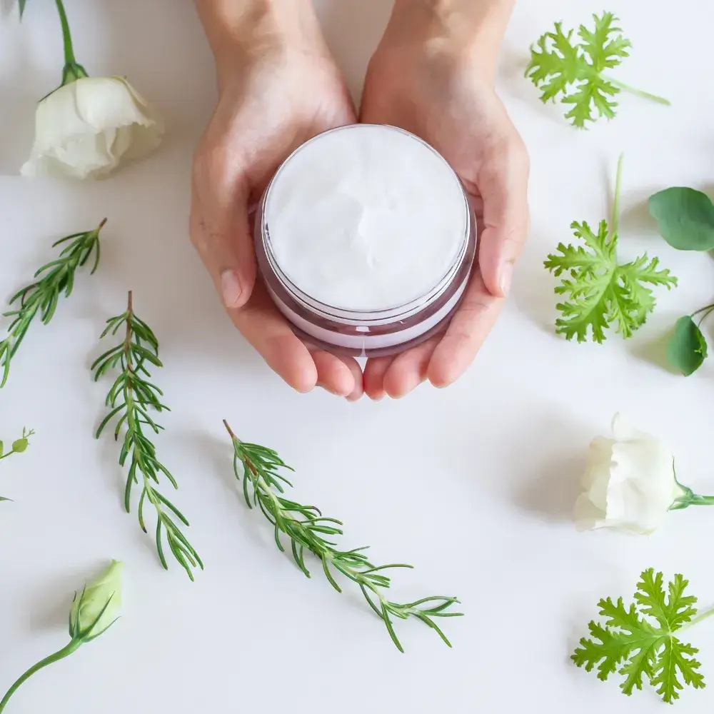 hand holding an organic face moisturizer